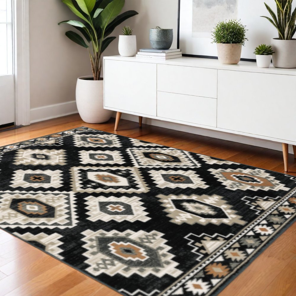 4' X 6' Black Grey Tan Orange And Ivory Southwestern Power Loom Stain Resistant Area Rug