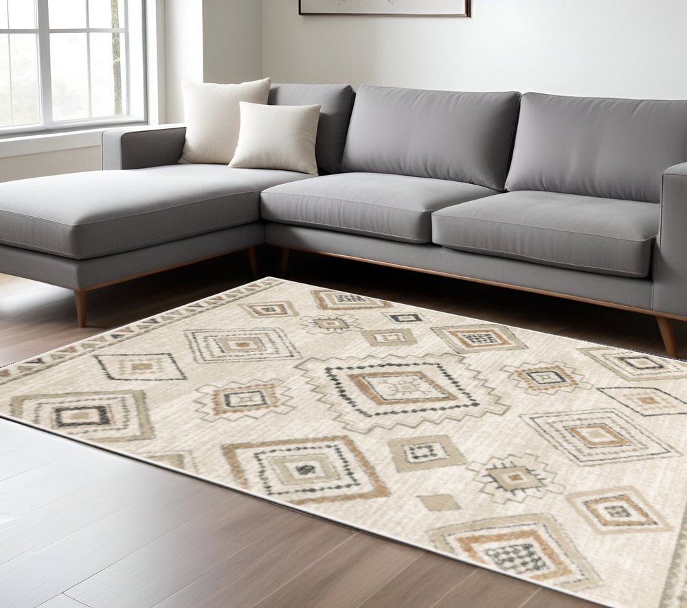10' X 13' Ivory Orange Tan Black And Grey Southwestern Power Loom Stain Resistant Area Rug