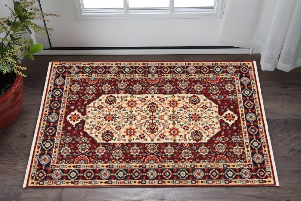 2' X 3' Red Ivory Blue And Orange Oriental Power Loom Stain Resistant Area Rug With Fringe