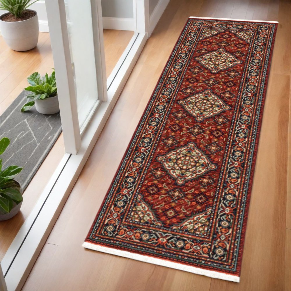 2' X 6' Red Blue Ivory And Orange Oriental Power Loom Stain Resistant Runner Rug With Fringe