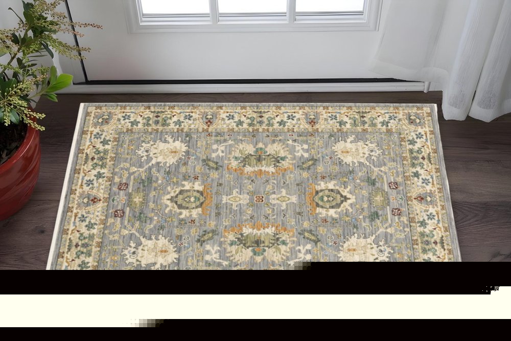 3' X 5' Grey Ivory Orange Teal Green Charcoal Blue And Red Oriental Power Loom Stain Resistant Area Rug With Fringe
