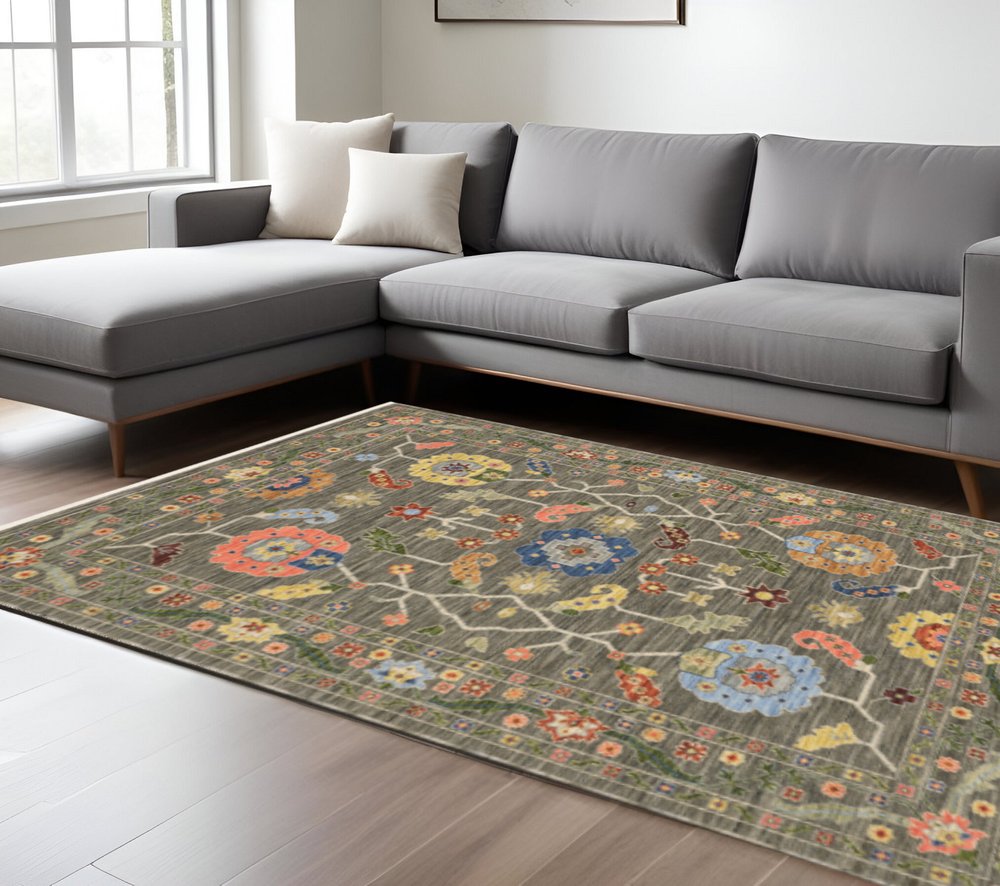 6' X 9' Grey Blue Pink Orange Rust Red Green And Ivory Oriental Power Loom Stain Resistant Area Rug With Fringe