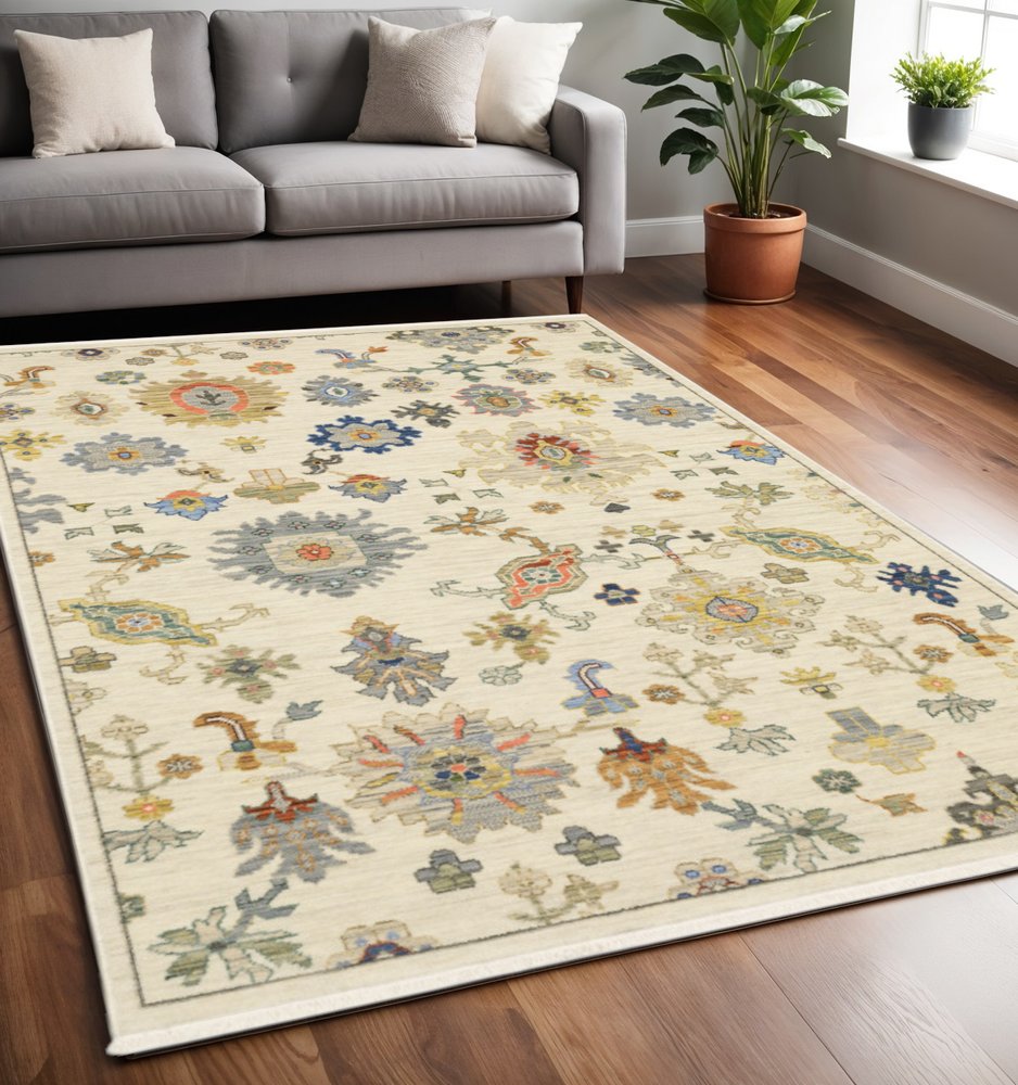 5' X 8' Ivory Beige And Blue Oriental Area Rug With Fringe