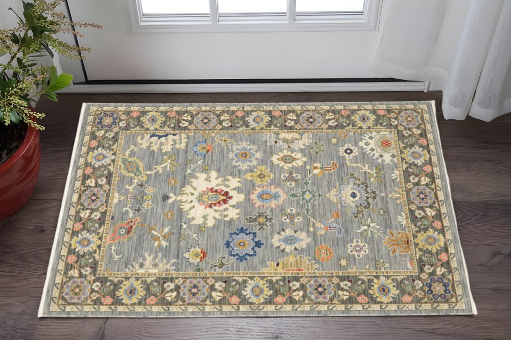 2' X 3' Blue Grey Gold Green Pink Orange Ivory And Red Oriental Power Loom Stain Resistant Area Rug With Fringe