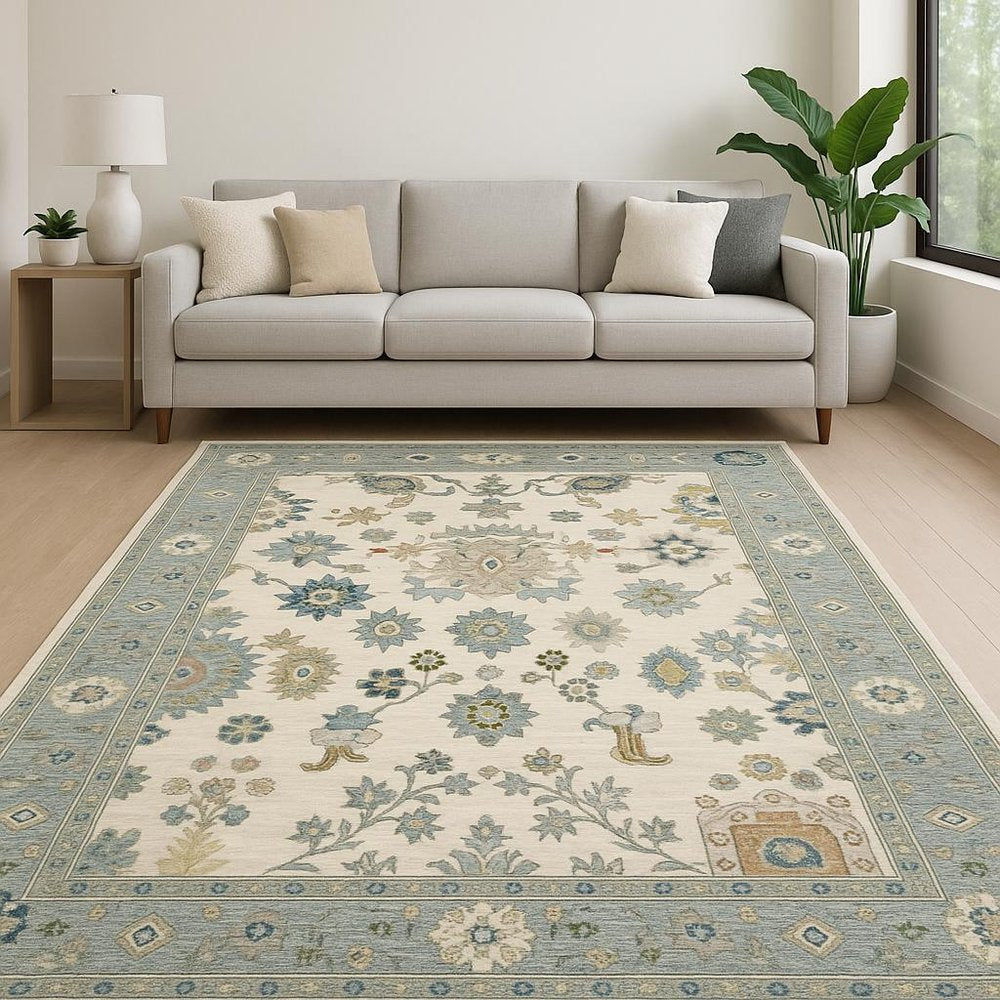 6' X 9' Ivory Blue Grey Teal Gold Green And Rust Oriental Power Loom Stain Resistant Area Rug With Fringe