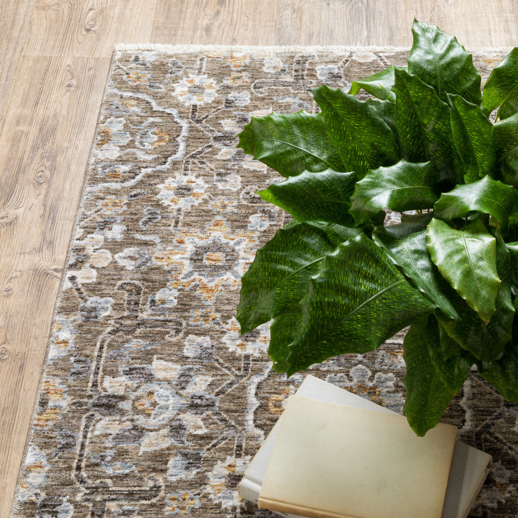 7' X 10' Gray And Gold Floral Area Rug With Fringe