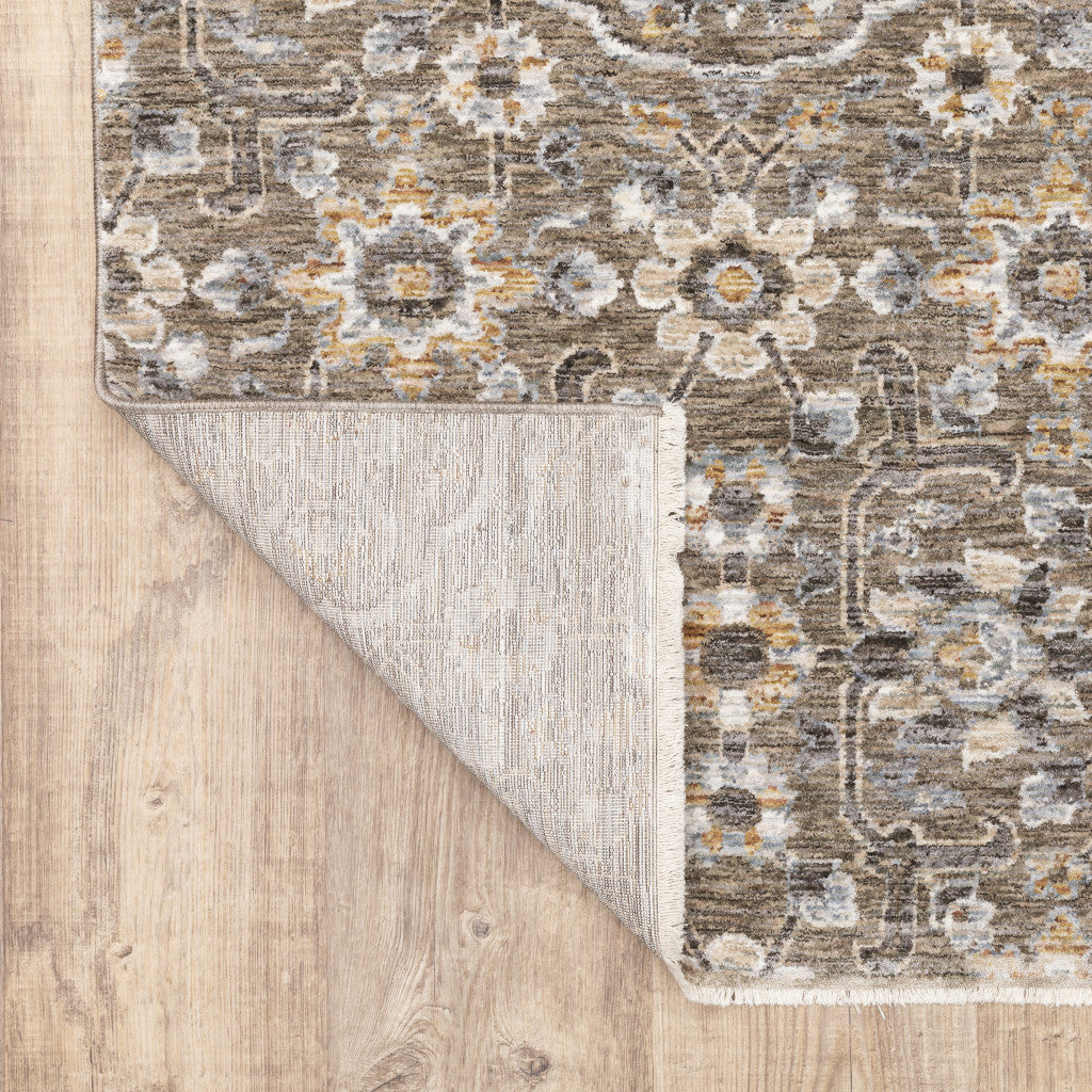 7' X 10' Gray And Gold Floral Area Rug With Fringe
