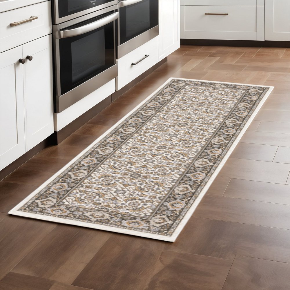 2' X 8' Ivory And Grey Oriental Power Loom Stain Resistant Runner Rug With Fringe