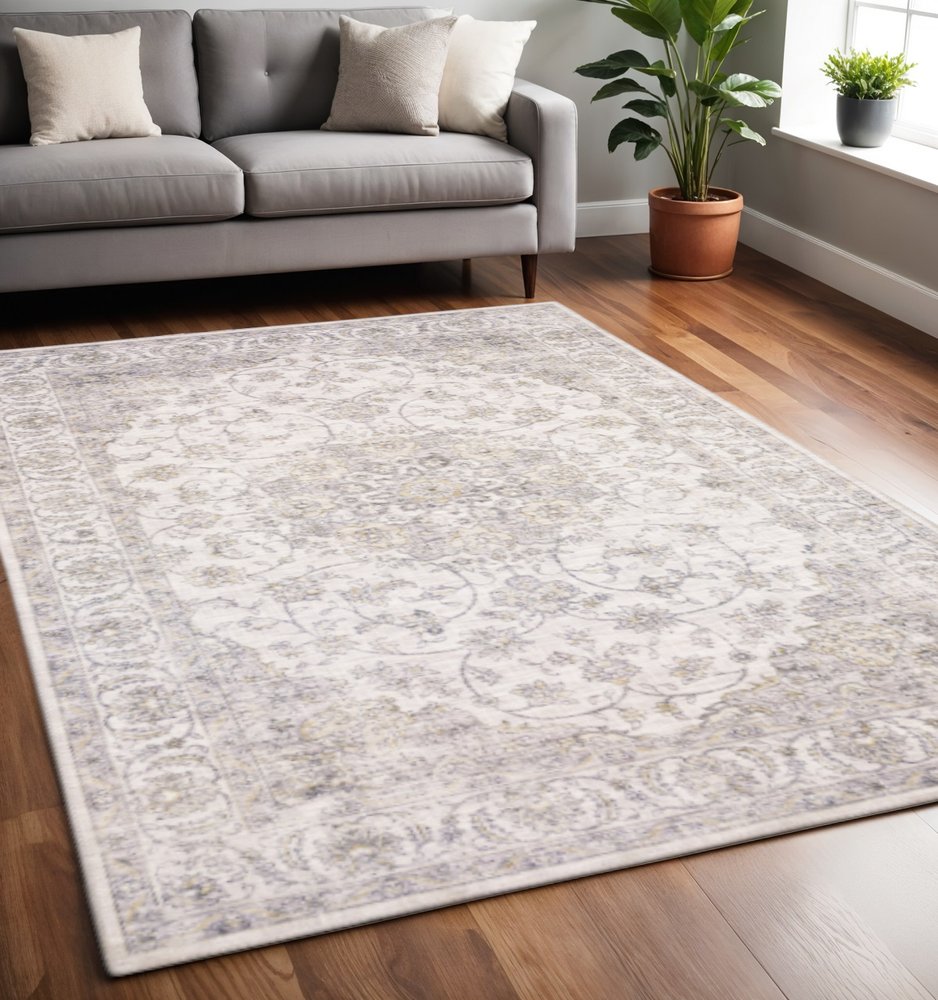 5' X 7' Beige Gold And Grey Oriental Power Loom Stain Resistant Area Rug