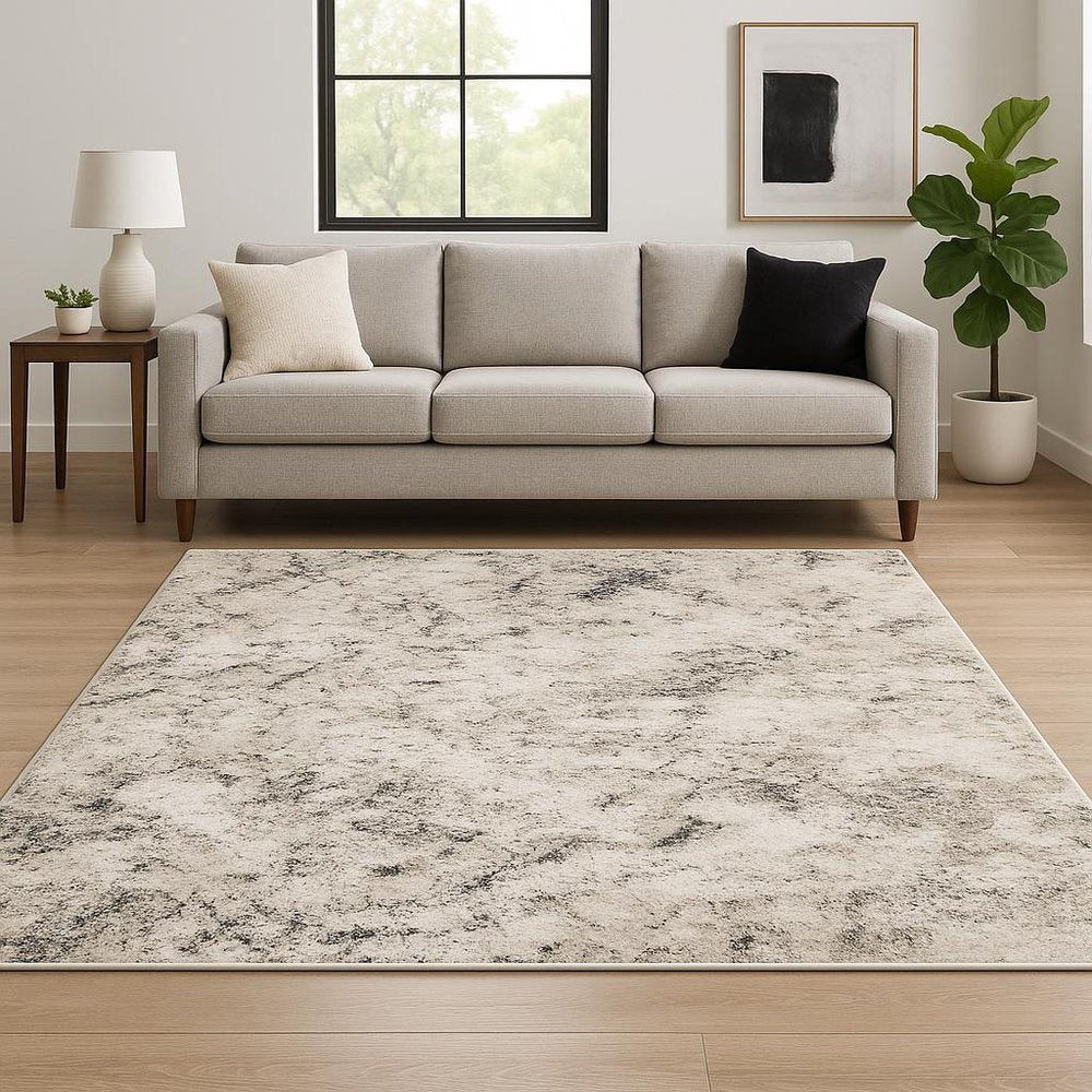 10' X 13' Ivory Grey Black Beige And Tan Abstract Power Loom Stain Resistant Area Rug