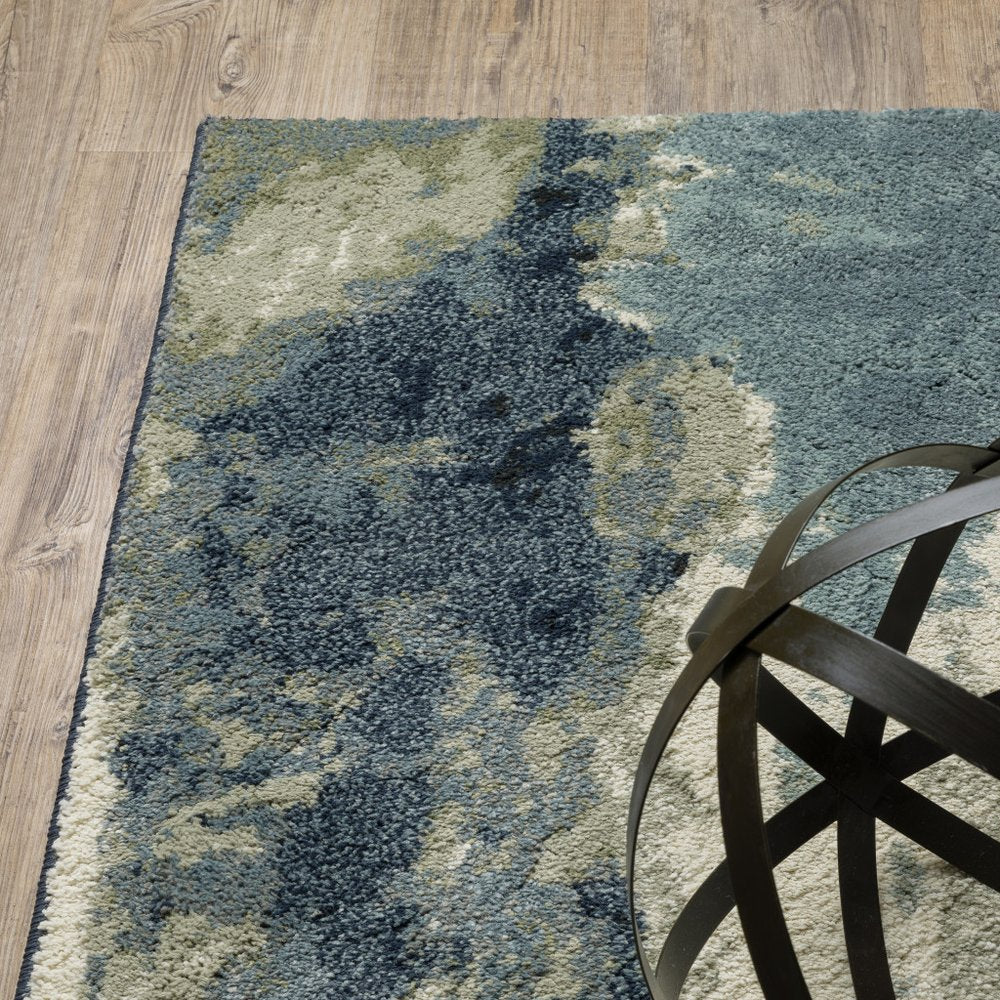 10' X 13' Blue Green And Ivory Abstract Area Rug