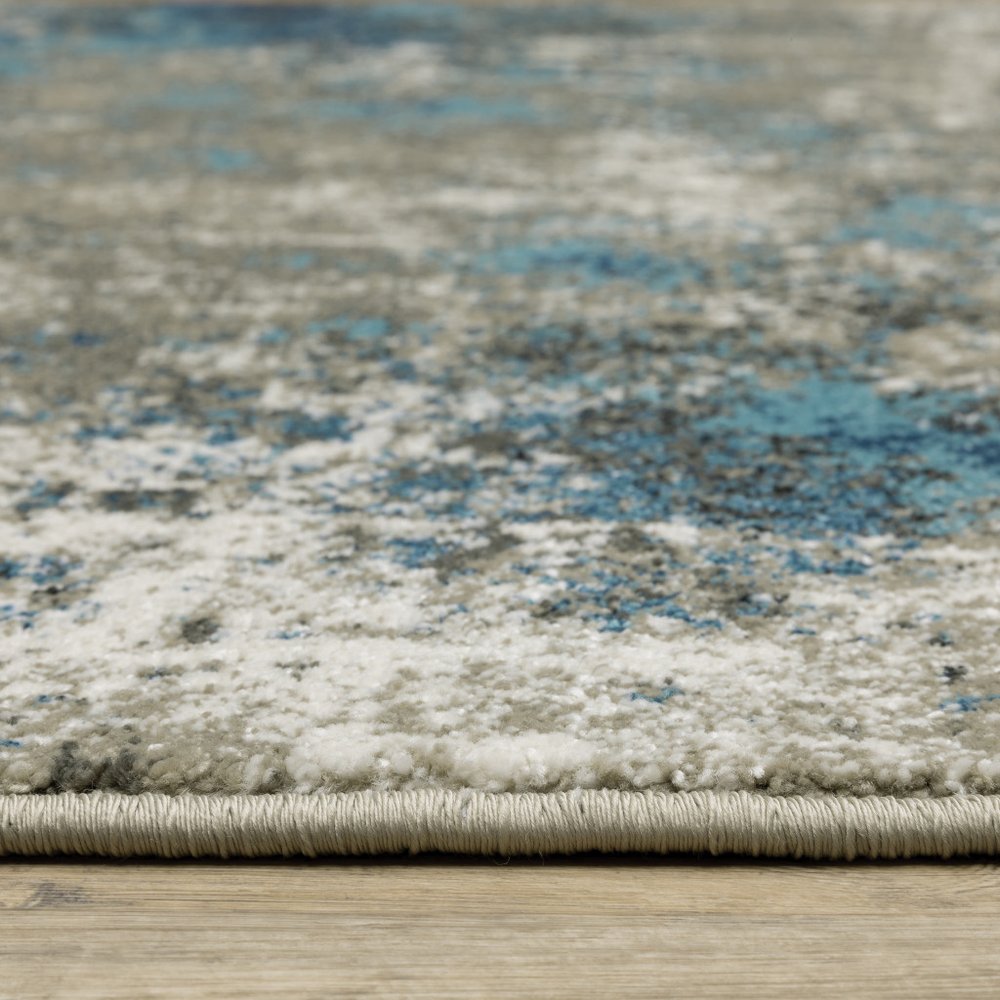 5' X 7' Blue Grey And Beige Abstract Power Loom Stain Resistant Area Rug