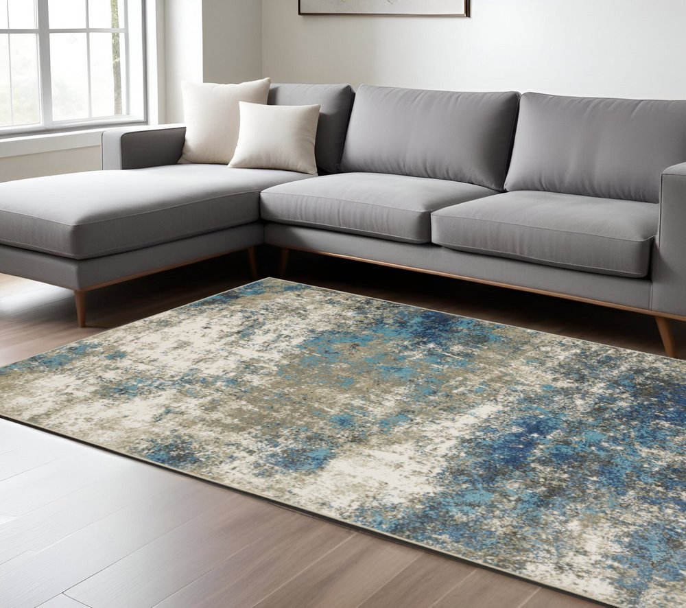 7' X 9' Blue And Beige Abstract Area Rug