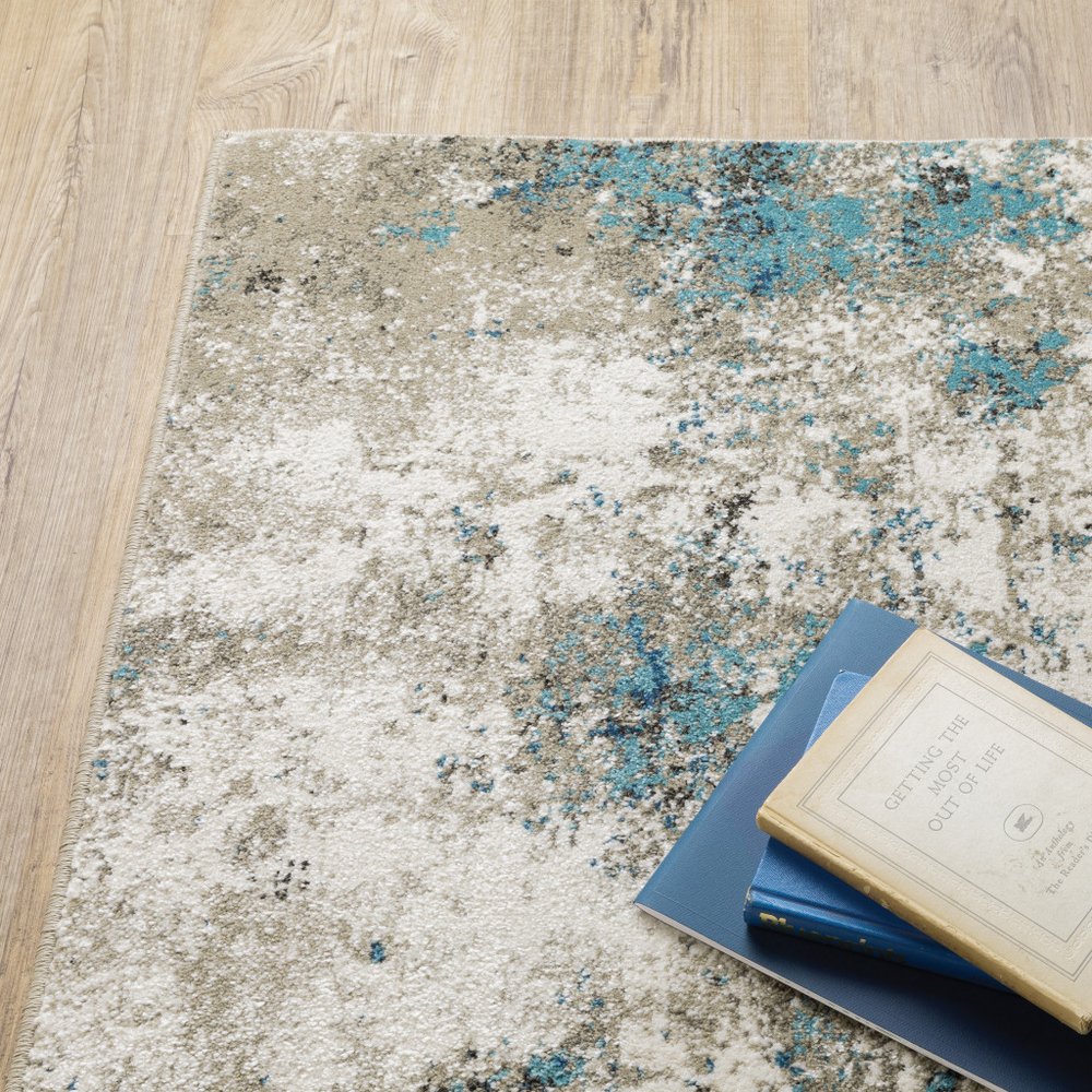 7' X 9' Blue And Beige Abstract Area Rug