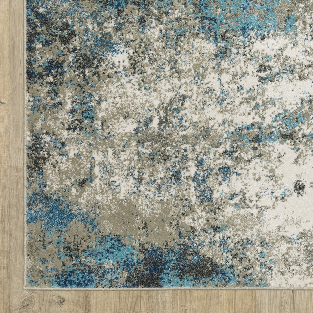 7' X 9' Blue And Beige Abstract Area Rug