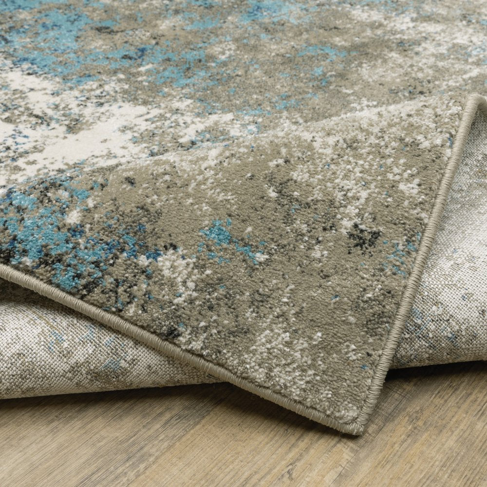 7' X 9' Blue And Beige Abstract Area Rug