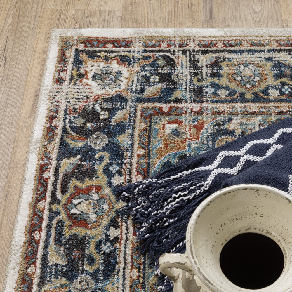 7' X 9' Beige And Blue Oriental Distressed Area Rug