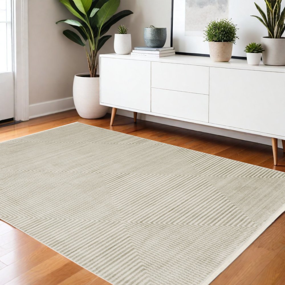 4' X 6' Ivory Beige Taupe And Tan Geometric Power Loom Stain Resistant Area Rug With Fringe