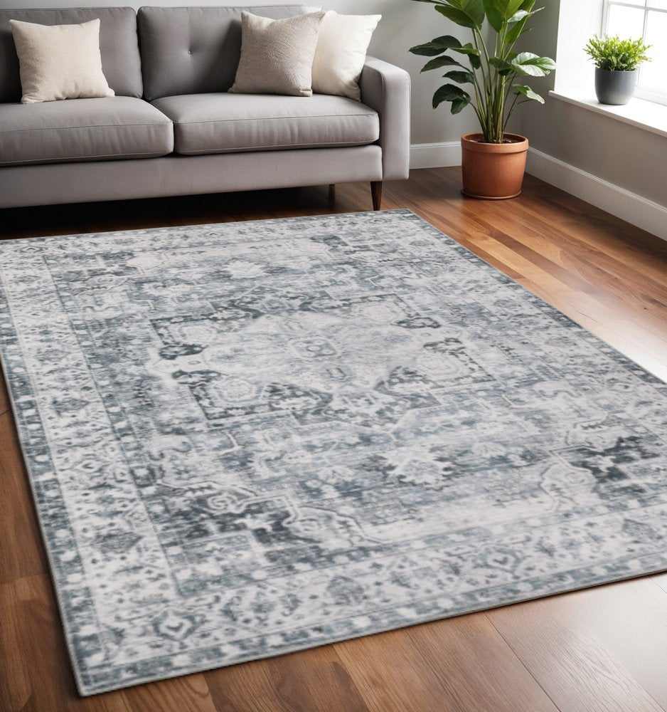 5' X 7' Navy Blue Ivory And Grey Oriental Printed Stain Resistant Non Skid Area Rug