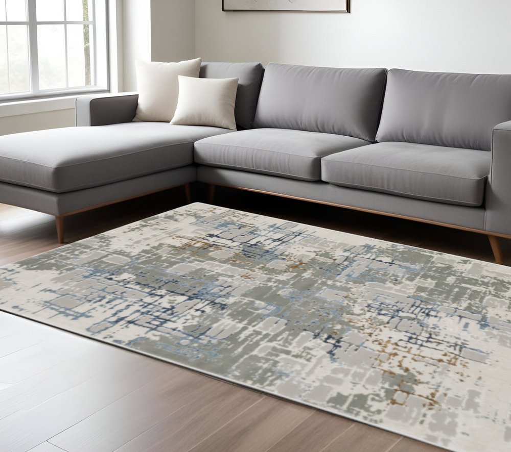 8' X 11' Grey Blue Brown Ivory And Deep Blue Abstract Power Loom Stain Resistant Area Rug