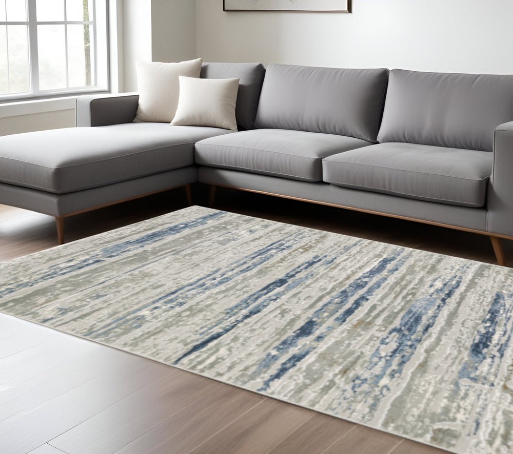 8' X 11' Blue Ivory Grey Light Blue And Brown Abstract Power Loom Stain Resistant Area Rug