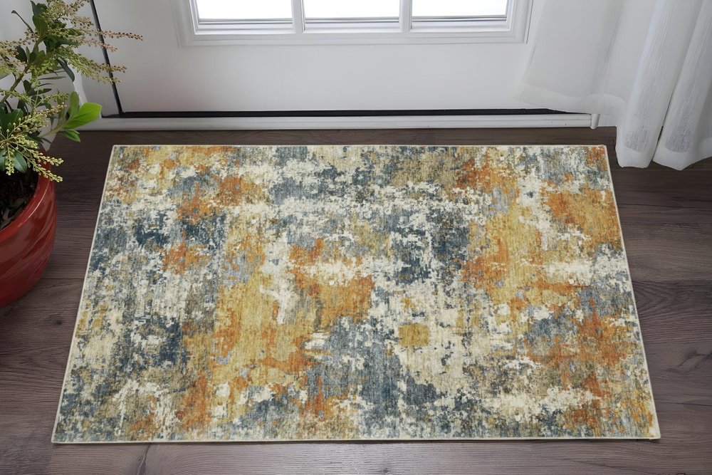 2' X 3' Teal Blue Orange Gold Grey Tan Brown And Beige Abstract Printed Stain Resistant Non Skid Area Rug