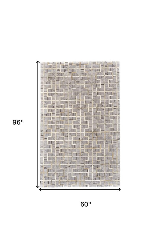 5' X 8' Tan and Brown Geometric Hand Woven Area Rug