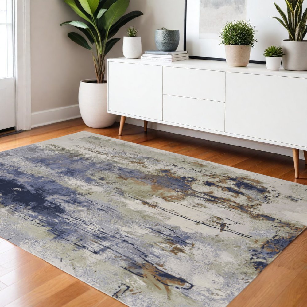 5' X 8' Blue Orange And Ivory Abstract Power Loom Area Rug