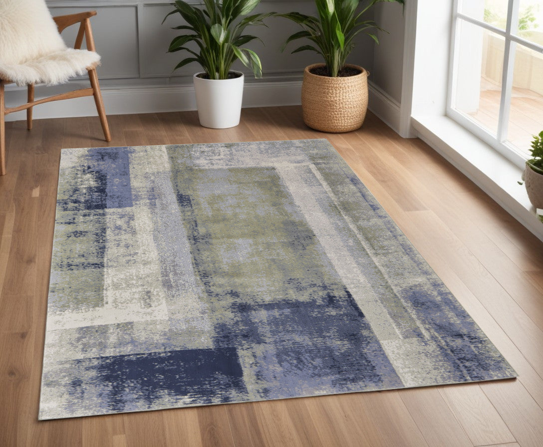 9' X 12' Blue Green And Ivory Abstract Power Loom Distressed Area Rug