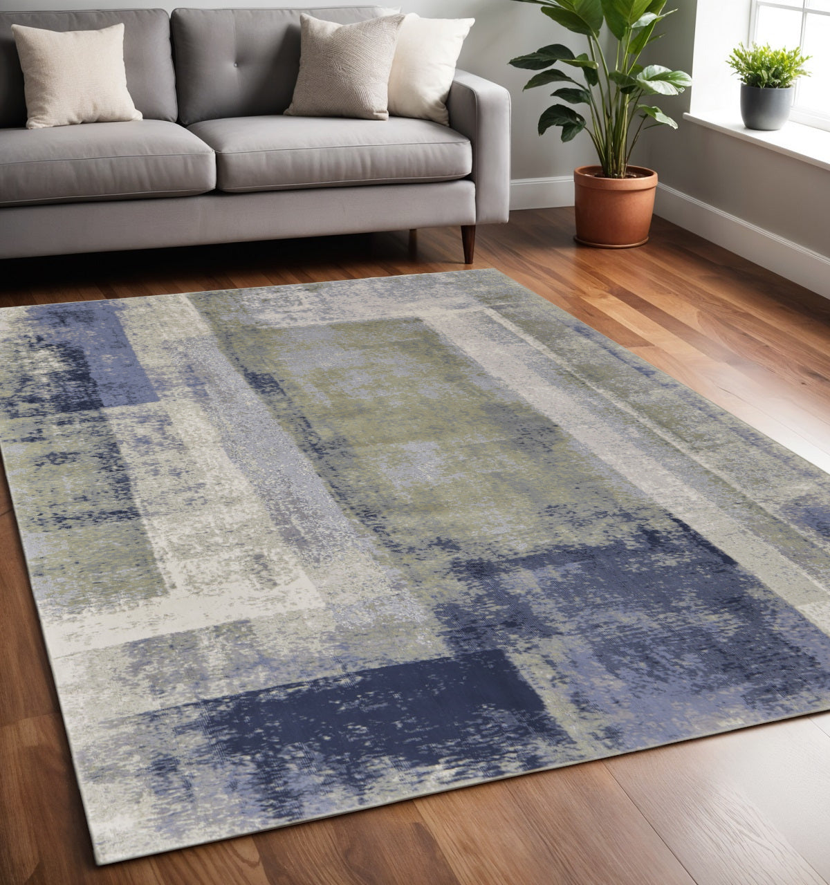9' X 12' Blue Green And Ivory Abstract Power Loom Distressed Area Rug