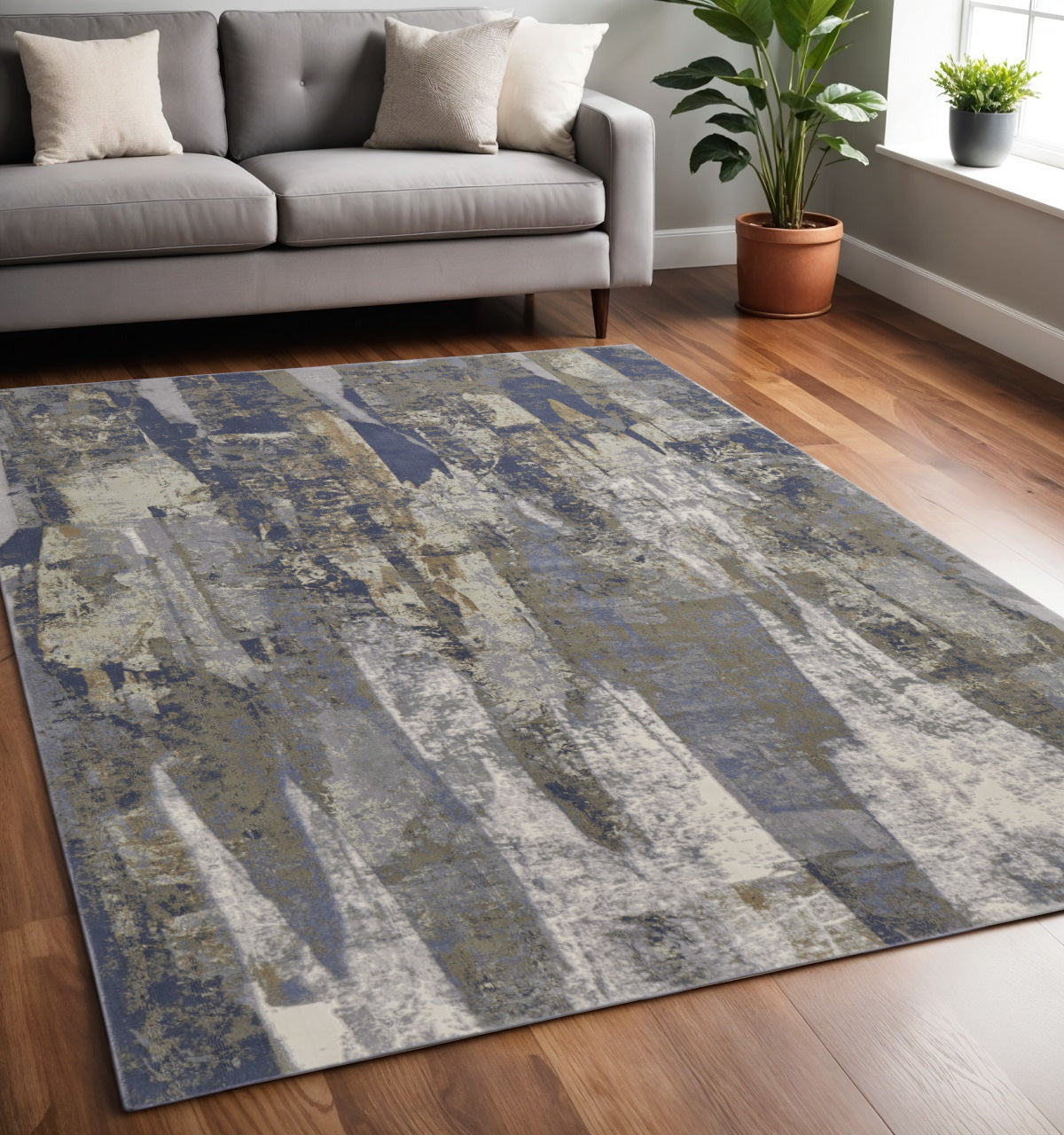 5' X 8' Blue and Ivory Abstract Power Loom Distressed Area Rug