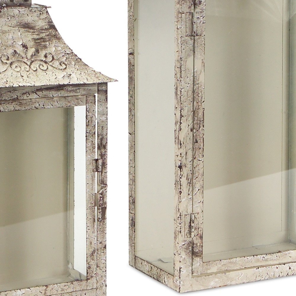 Set of Two Beige Distressed Filigree Iron And Glass Floor Lantern Candle Holders