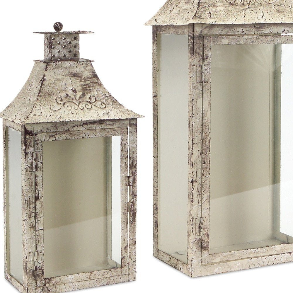 Set of Two Beige Distressed Filigree Iron And Glass Floor Lantern Candle Holders