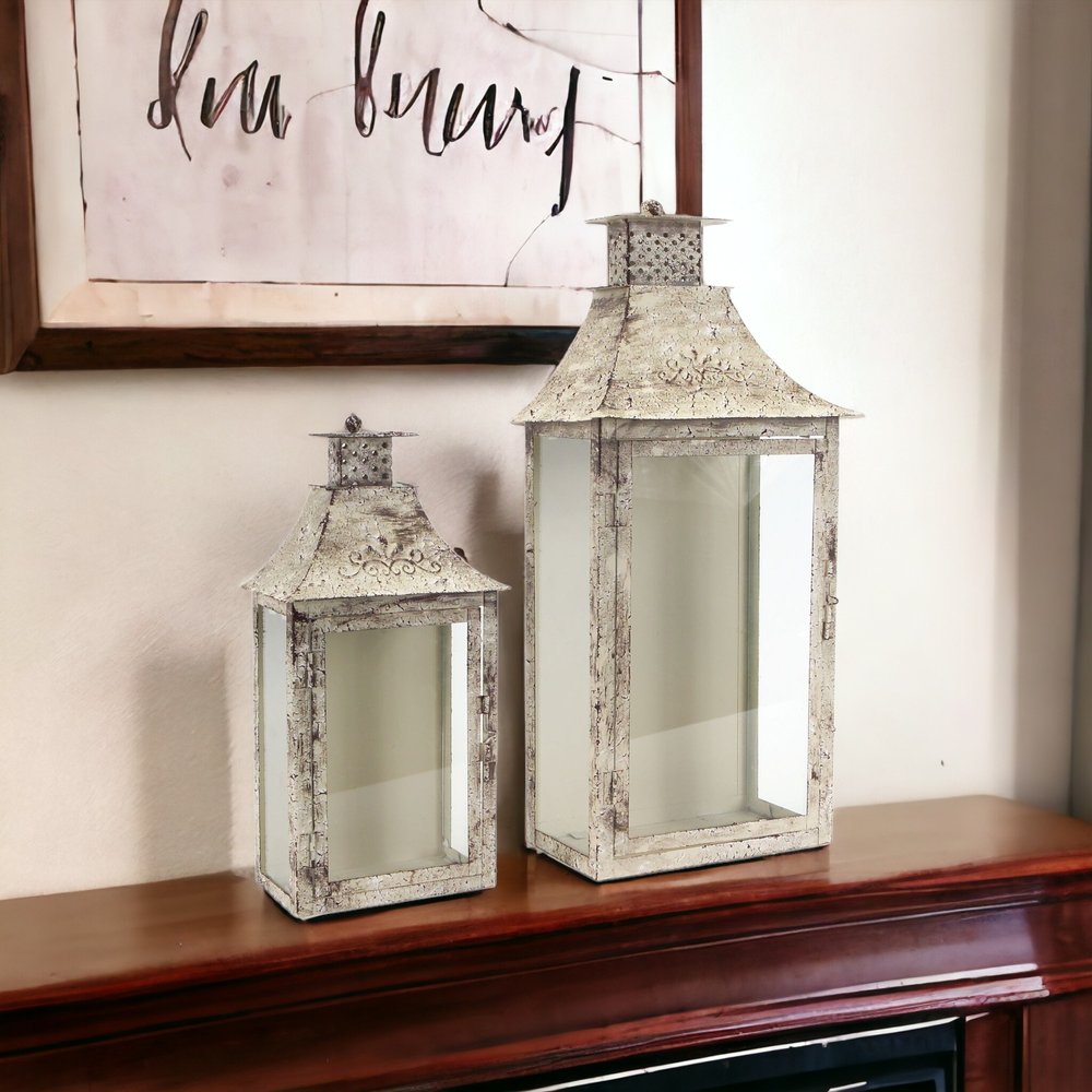 Set of Two Beige Distressed Filigree Iron And Glass Floor Lantern Candle Holders