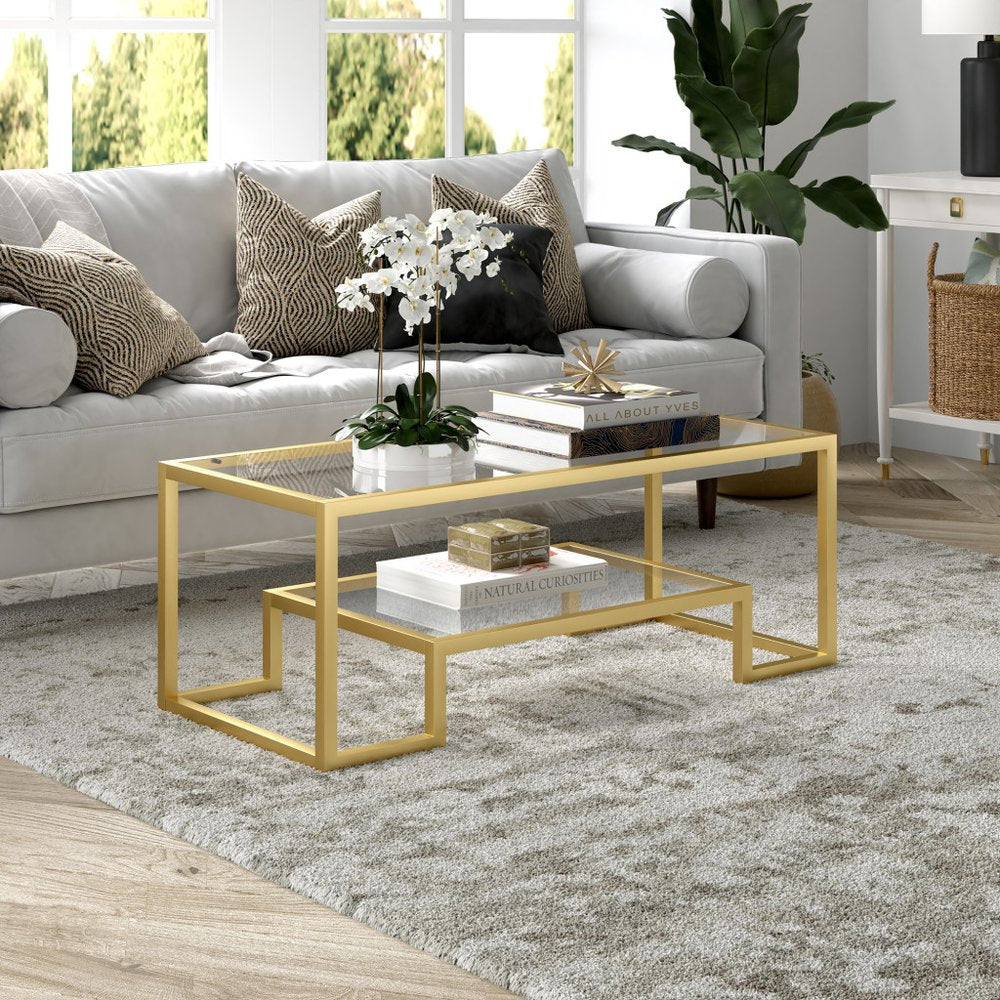 45" Clear And Gold Glass And Steel Sled Coffee Table With Shelf