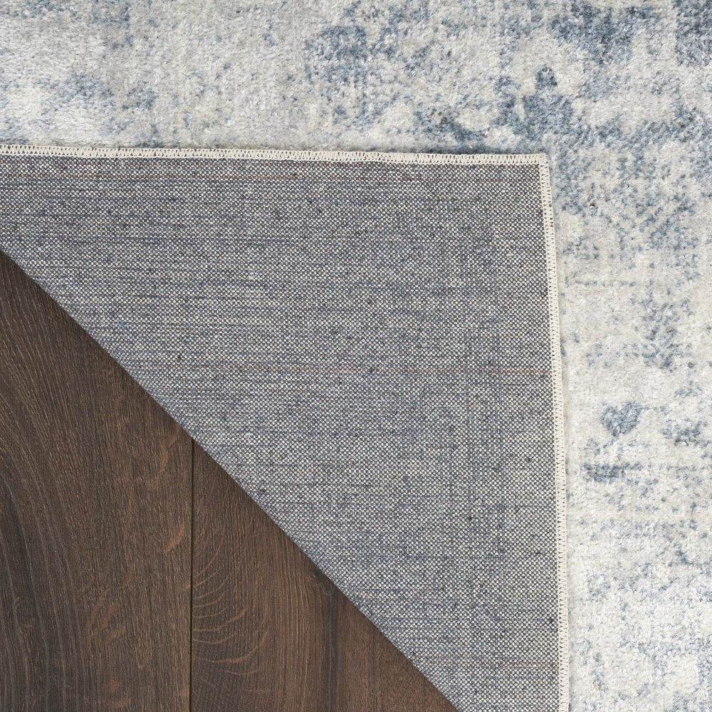 9' X 12' Blue and Ivory Oriental Power Loom Distressed Area Rug