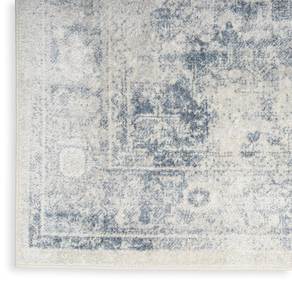 9' X 12' Blue and Ivory Oriental Power Loom Distressed Area Rug