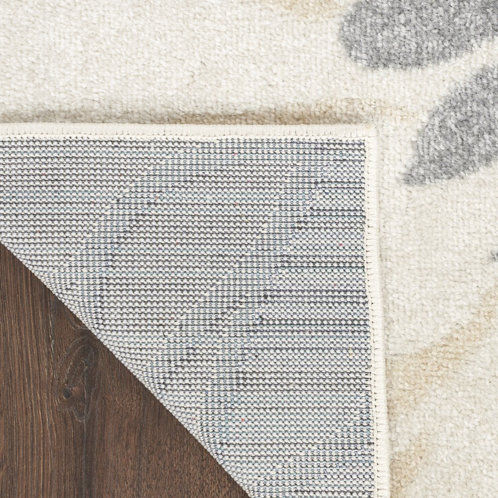 5' X 7' Cream Floral Power Loom Distressed Area Rug