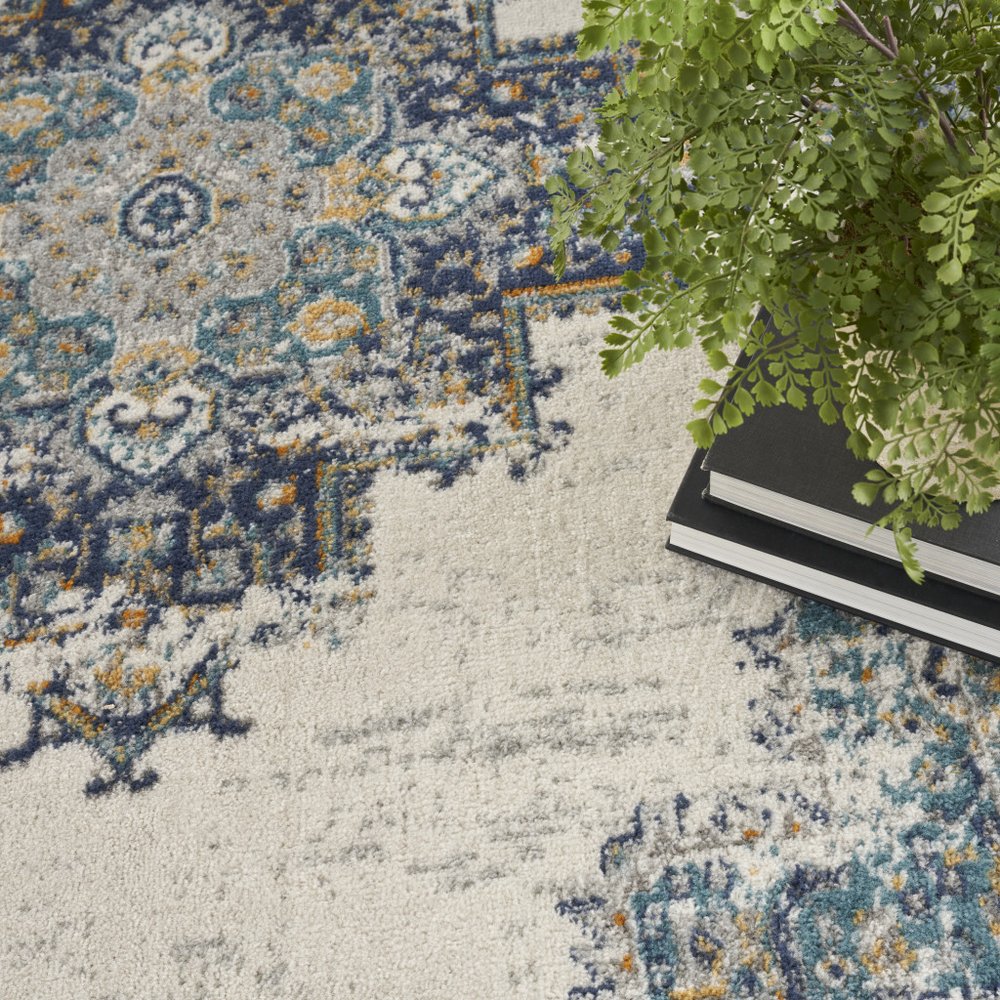 5' X 7' Cream Floral Power Loom Distressed Area Rug