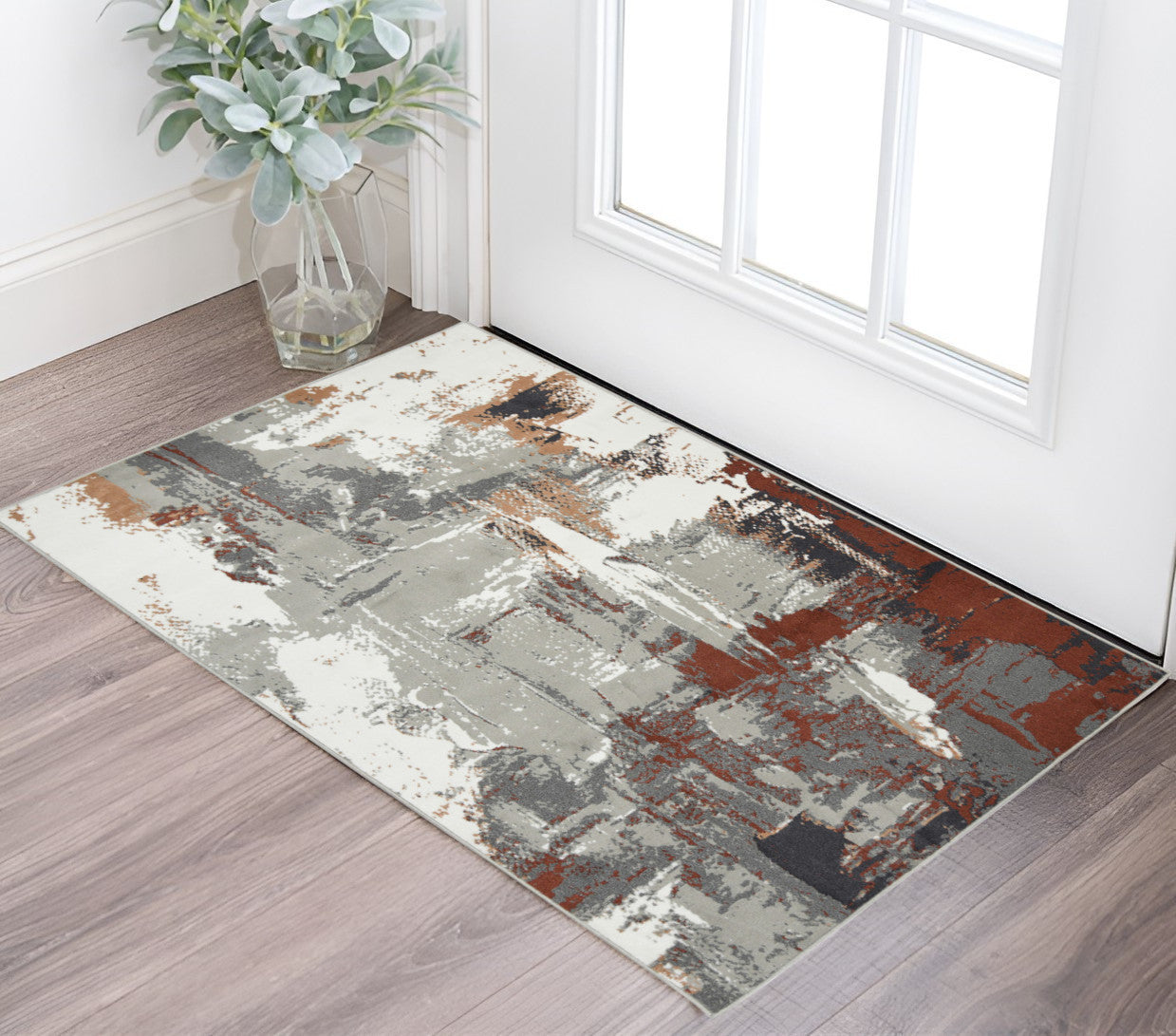 8' Ivory Gray and Rust Abstract Power Loom Round Rug