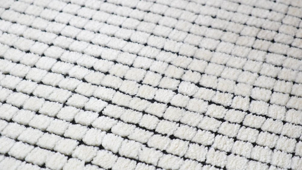 5' X 8' Beige and Black Checkered Power Loom Distressed Area Rug
