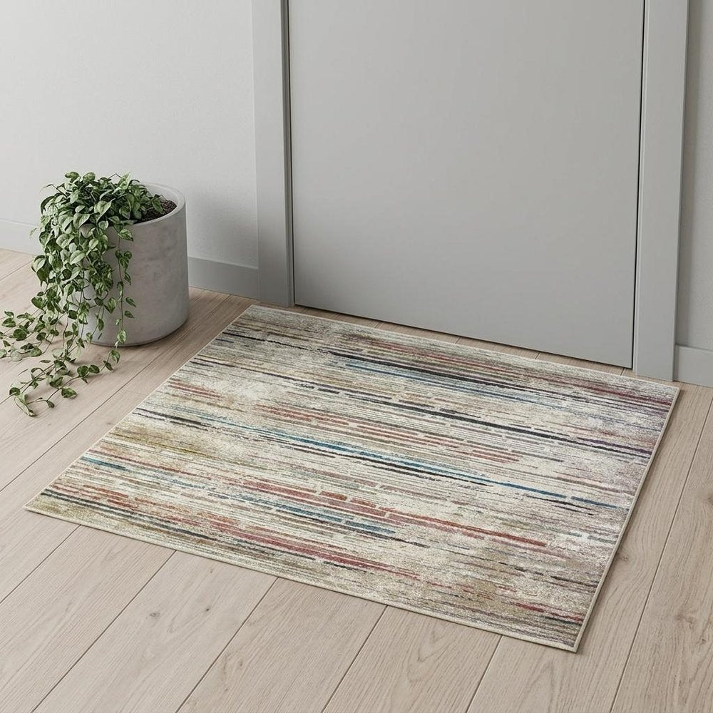 2' X 3' Beige Geometric Distressed Area Rug With Fringe