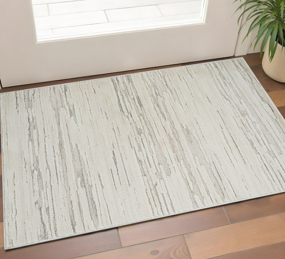 2' X 5' Gray and Beige Geometric Distressed Area Rug