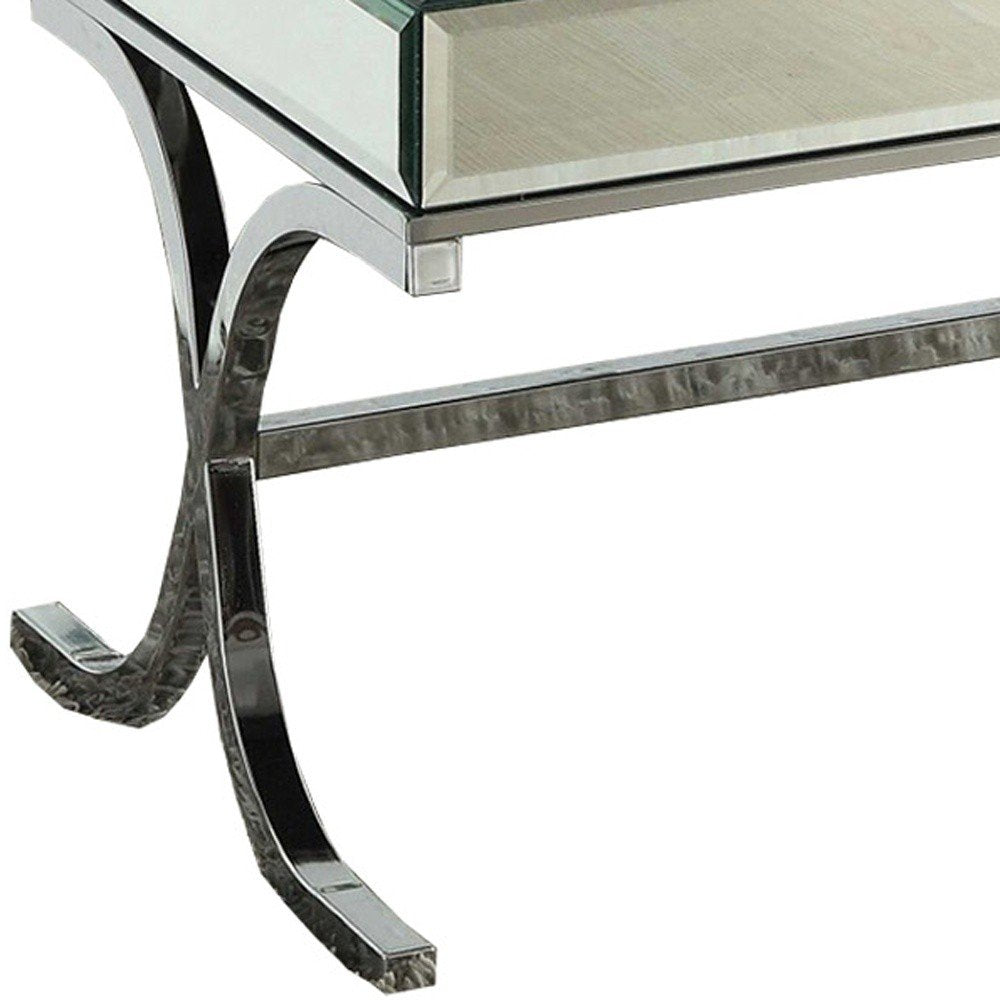 42" Clear and Silver Mirrored Glass And Iron Sled Coffee Table