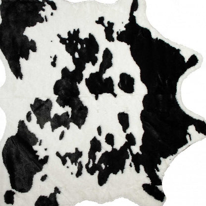 4' X 5' Brown And White Cowhide Print Hand Knotted Area Rug
