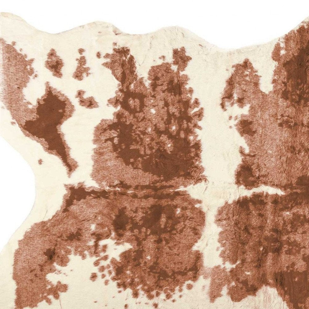 4' X 5' Brown And Ivory Faux Cowhide Animal Print Area Rug
