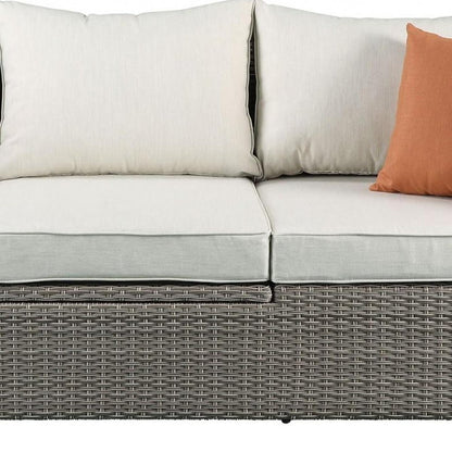 Three Piece Outdoor Gray Wicker Sectional Seating Group with Beige Cushions