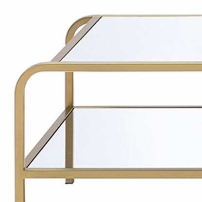 52" Clear and Gold Mirrored Glass And Iron Coffee Table With Shelf