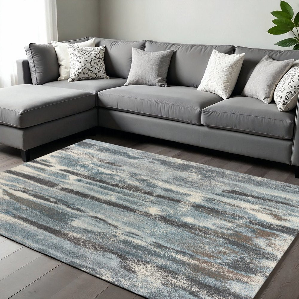 7' X 10' Teal Blue And White Abstract Area Rug