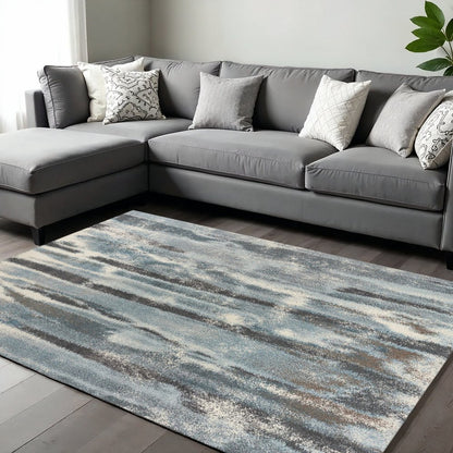 7' X 10' Teal Blue And White Abstract Area Rug